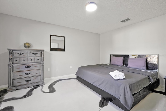 bedroom featuring a textured ceiling