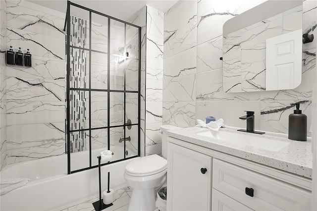 full bathroom featuring toilet, vanity, and bath / shower combo with glass door