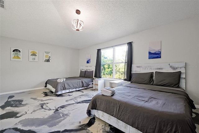 bedroom featuring a textured ceiling