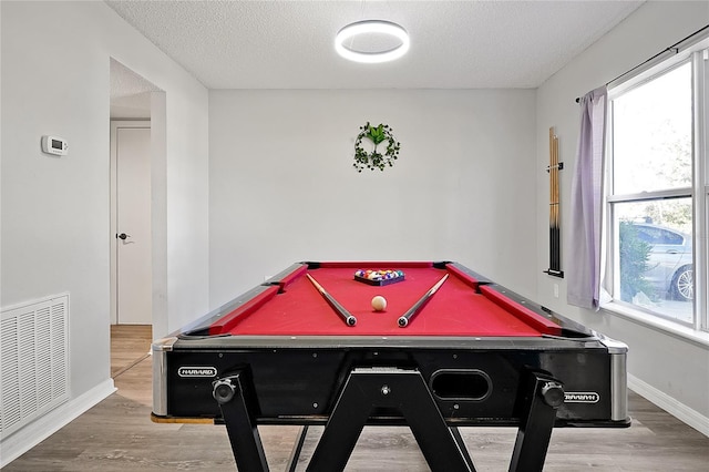 rec room featuring pool table, plenty of natural light, and wood-type flooring