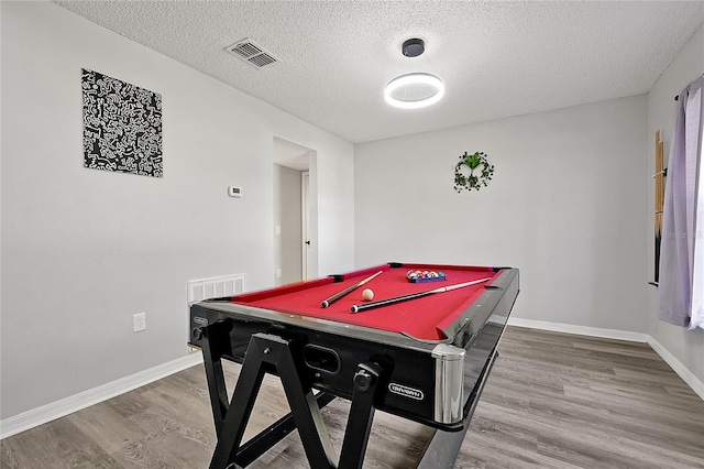 rec room with pool table, a textured ceiling, and wood-type flooring