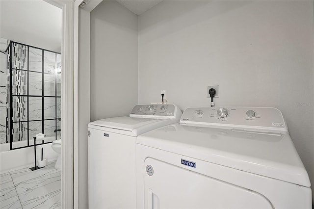 clothes washing area featuring washing machine and dryer