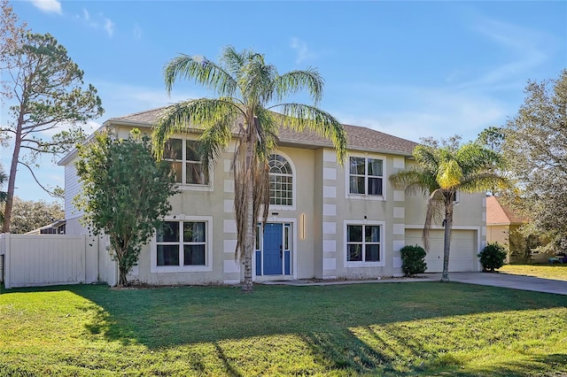 view of front facade with a front lawn and a garage