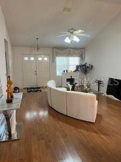 living room with ceiling fan and hardwood / wood-style flooring