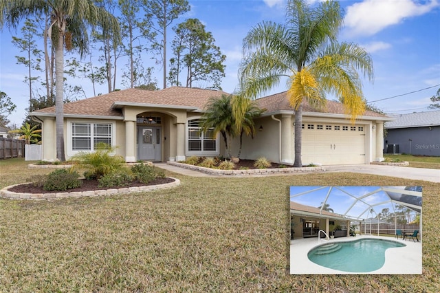 view of front of property featuring a front lawn, a fenced in pool, glass enclosure, and a garage