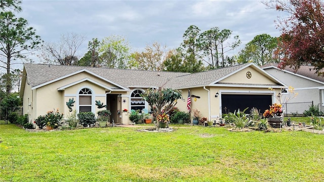 ranch-style home with a front yard and a garage