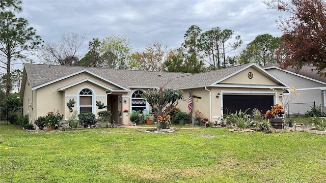 ranch-style house featuring a garage and a front lawn