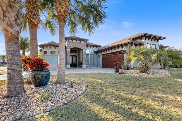 view of front facade featuring a front lawn and a garage