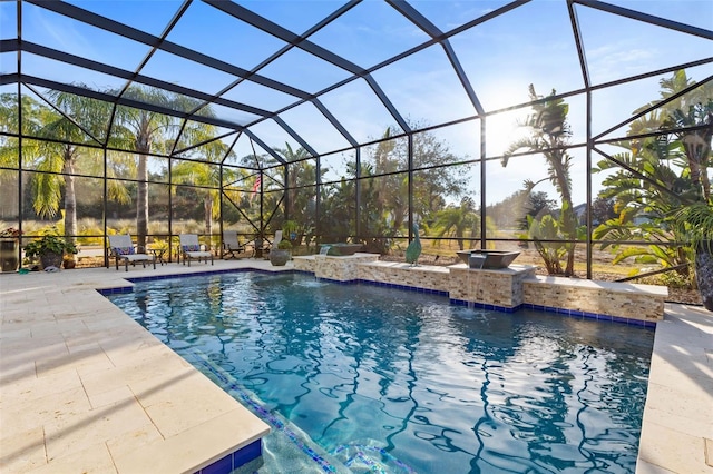 view of swimming pool featuring pool water feature, a patio area, and glass enclosure