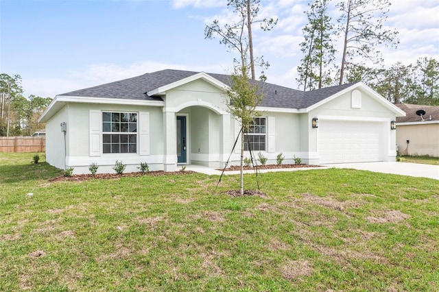 ranch-style home featuring a garage, driveway, roof with shingles, and a front lawn