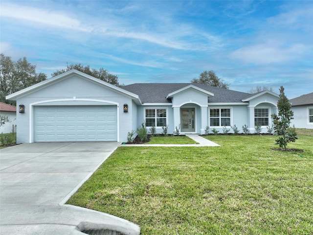 ranch-style house with stucco siding, concrete driveway, a front lawn, and a garage