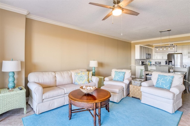 living room with a textured ceiling, ceiling fan, and crown molding