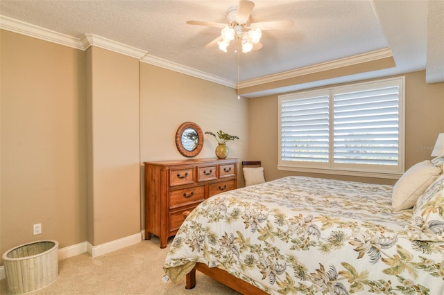 bedroom with light carpet, ceiling fan, a textured ceiling, and ornamental molding