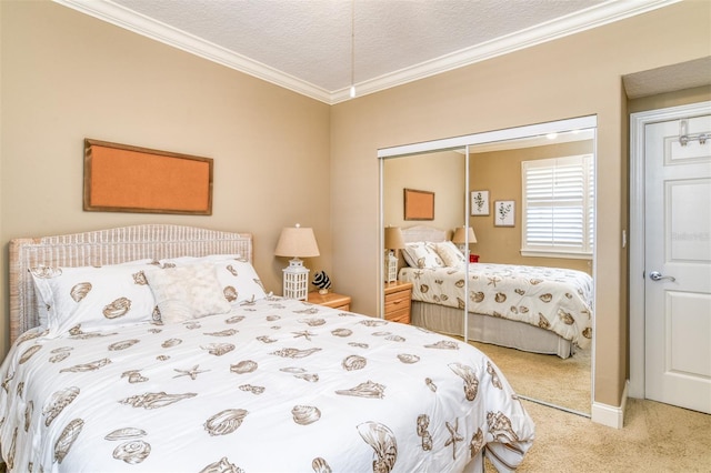 carpeted bedroom featuring a textured ceiling, a closet, and crown molding