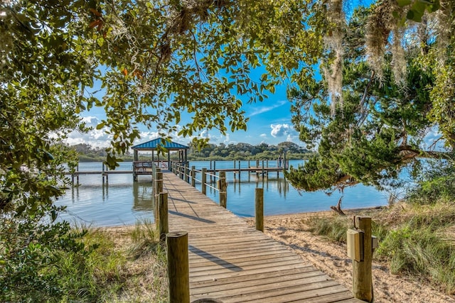 dock area featuring a gazebo and a water view