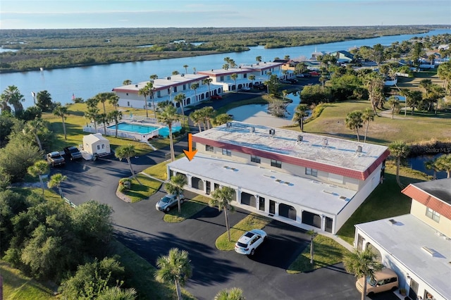 birds eye view of property with a water view