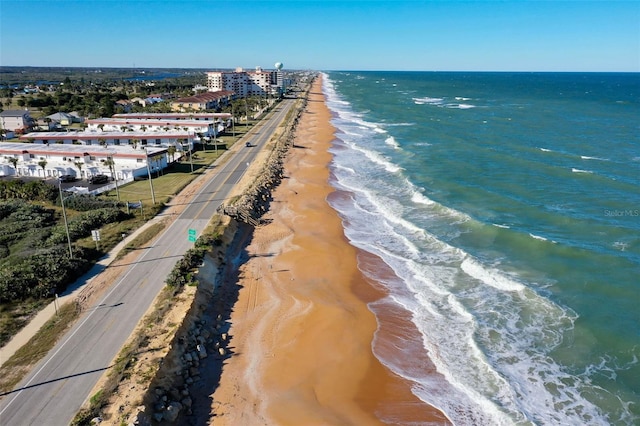 drone / aerial view with a view of the beach and a water view