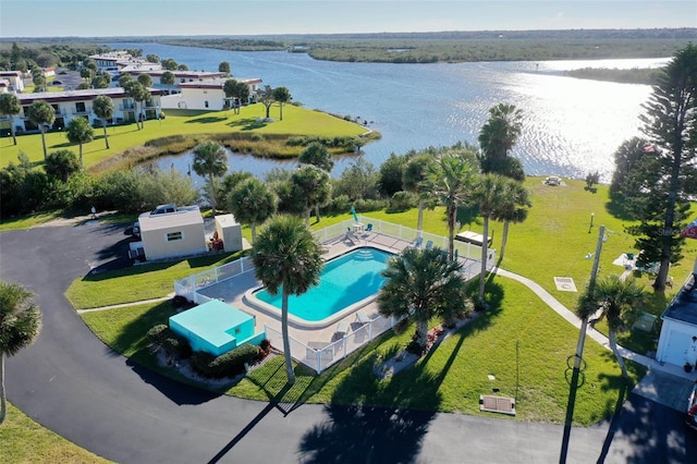 birds eye view of property with a water view