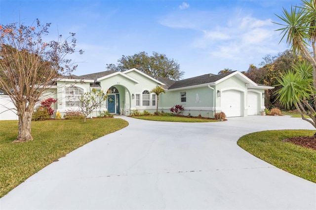 ranch-style house featuring a front yard and a garage