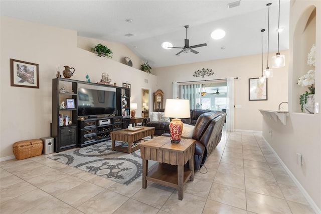 living room featuring light tile patterned floors and vaulted ceiling