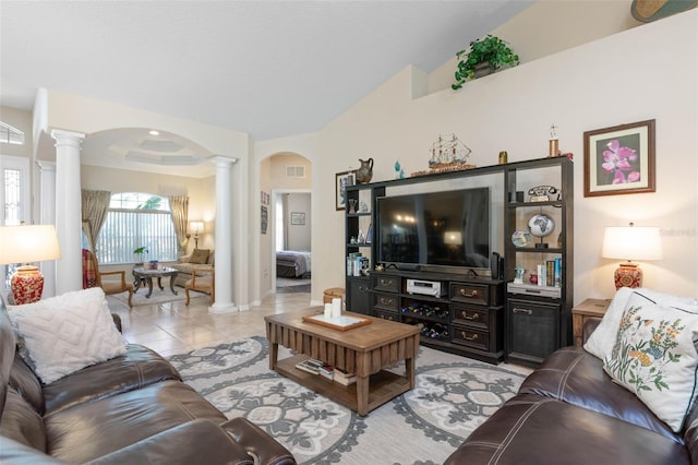 living room with light tile patterned floors and ornate columns