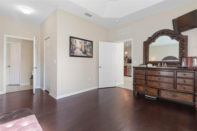 bedroom with hardwood / wood-style flooring