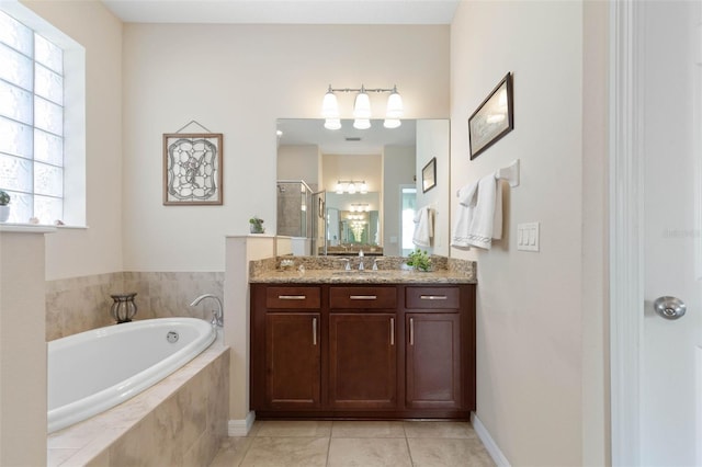 bathroom with vanity, tile patterned flooring, and shower with separate bathtub