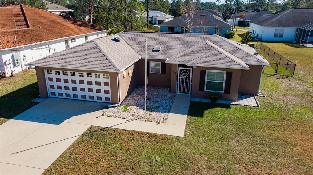 ranch-style house with a front yard and a garage