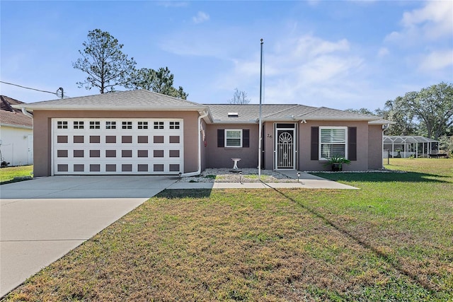 single story home with a garage and a front lawn