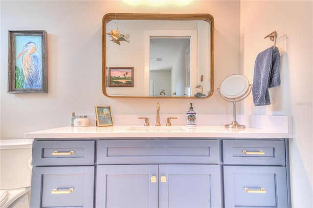 bathroom with toilet and vanity