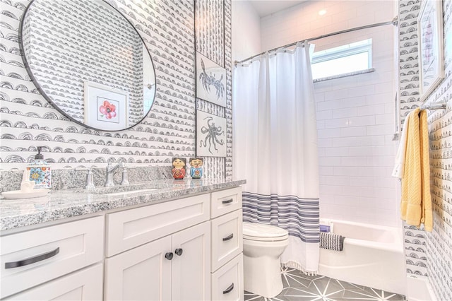 full bathroom with toilet, vanity, and shower / bath combo with shower curtain