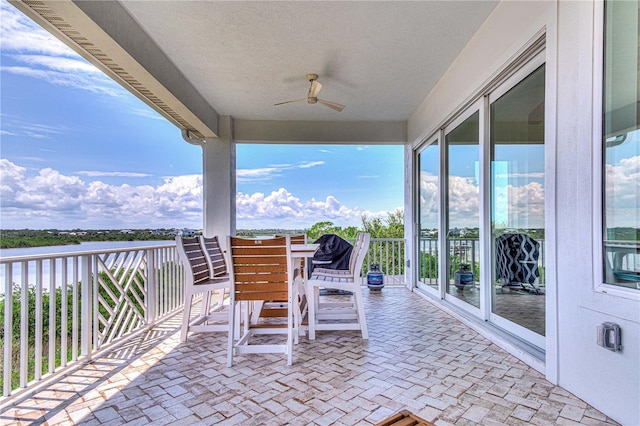 view of patio / terrace featuring ceiling fan