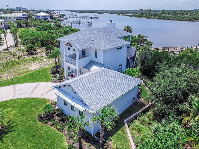 birds eye view of property with a water view