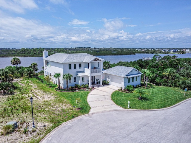 drone / aerial view featuring a water view