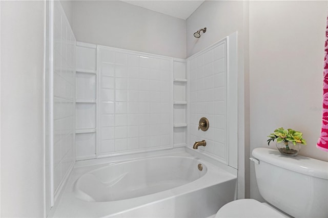 bathroom with shower / bathing tub combination and toilet