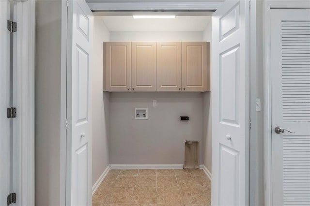 clothes washing area featuring electric dryer hookup, light tile patterned floors, hookup for a washing machine, and cabinets