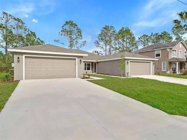 view of front of property with a garage and a front lawn