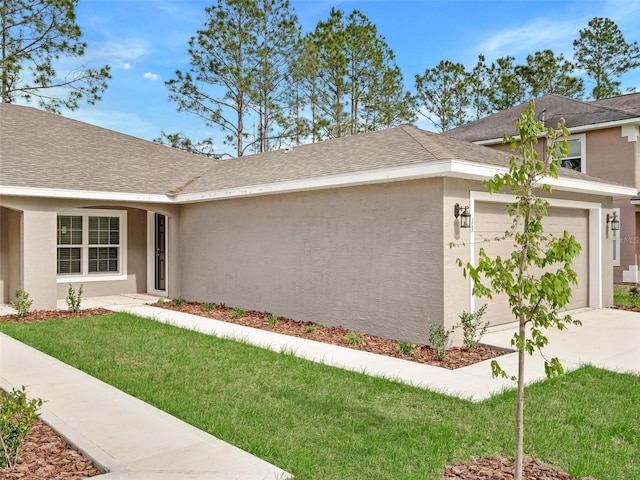 exterior space featuring a front yard and a garage