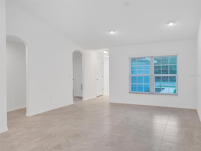 unfurnished room featuring light tile patterned floors