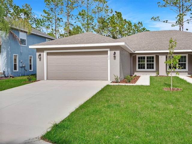 view of front facade featuring a front yard and a garage