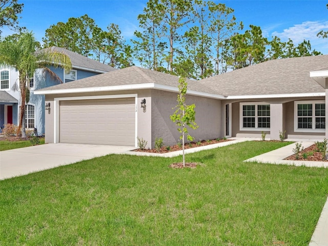 view of front of home featuring a front lawn and a garage