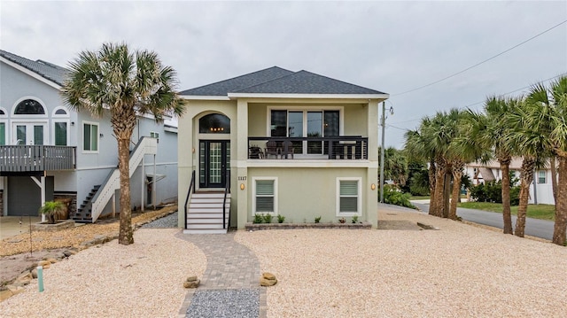 coastal home featuring a balcony