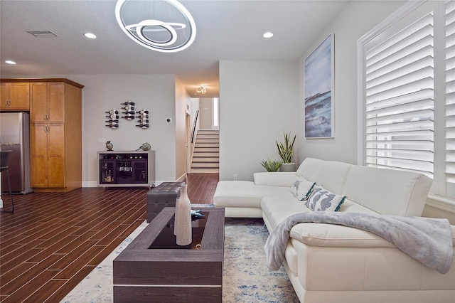 living room with dark hardwood / wood-style flooring