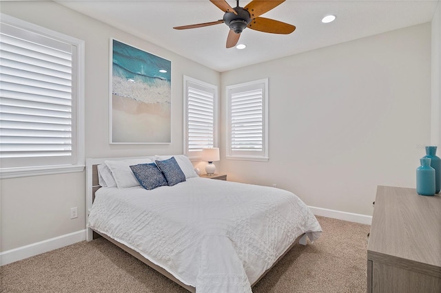 carpeted bedroom featuring ceiling fan