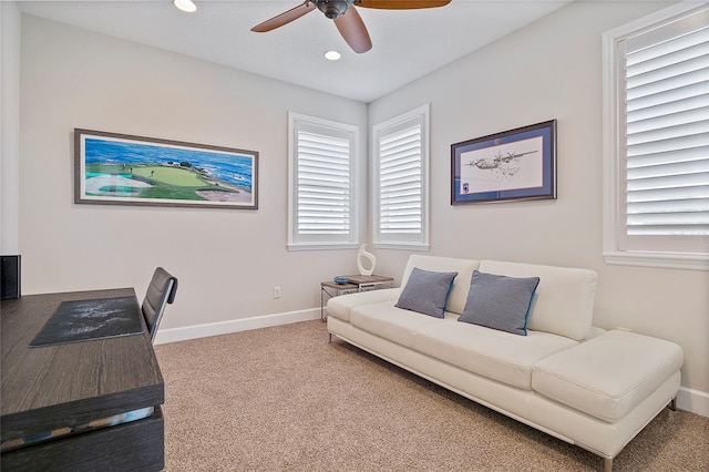 office space featuring ceiling fan and carpet