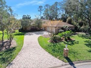 view of home's community featuring a lawn