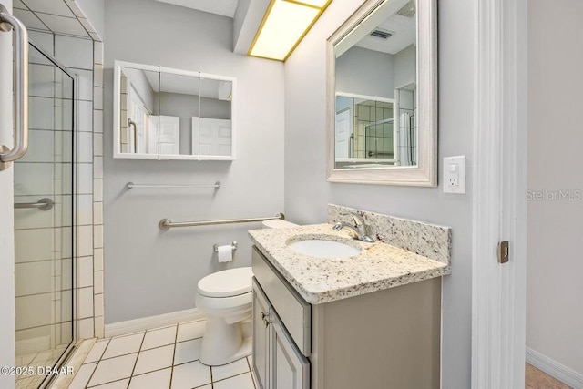 bathroom featuring an enclosed shower, vanity, tile patterned floors, and toilet