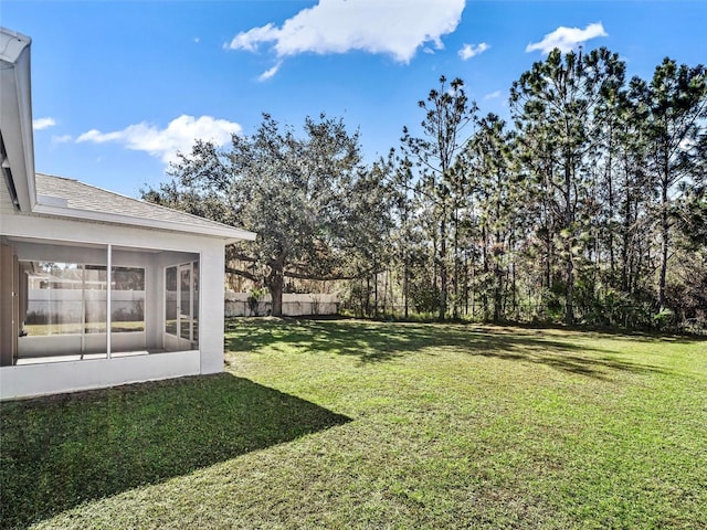 view of yard featuring a sunroom