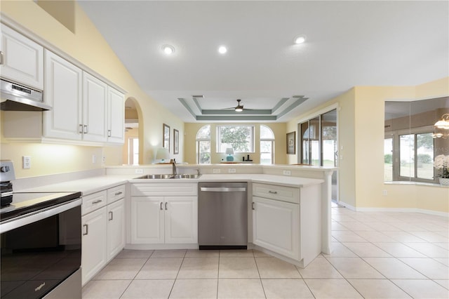 kitchen featuring kitchen peninsula, sink, white cabinetry, stainless steel appliances, and light tile patterned floors