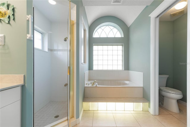 full bathroom featuring tile patterned flooring, vanity, toilet, vaulted ceiling, and independent shower and bath